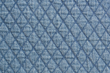 Quilted fabric blue denim cloth element texture close up background