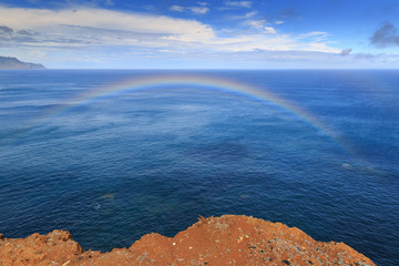 Beautiful landscape view of the east coast of the island Madeira at Ponta de Sao Lourenco nature reserve with a rainbow in the sky