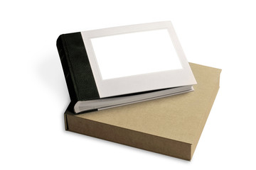 a cardboard box with a pictures album inside