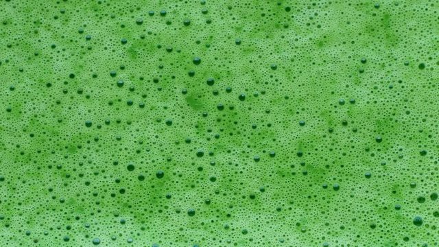 Green vegetable smoothie  in macro view. Healthy lifestyle food concept.