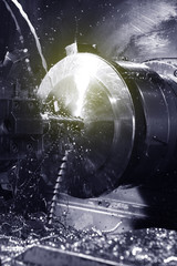 Spindle chuck and installed metal part in pocessing on high precision Cnc industrial lathe turning...