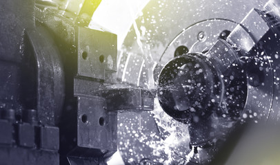 Spindle chuck and installed metal part in pocessing on high precision Cnc industrial lathe turning...