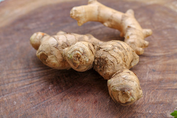 Ginger root  on wooden background