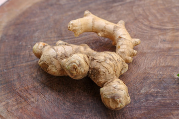 Ginger root  on wooden background