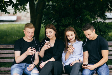 Friends group having fun using mobile smart phone