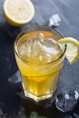 Glass of refreshing homemade lemonade with ice and mint
