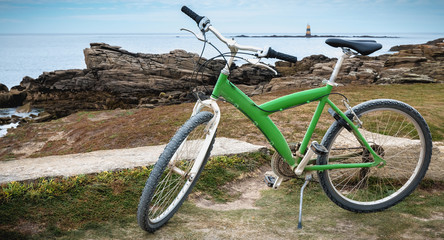 Fototapeta na wymiar green bike on the sea coast on the Yeu island