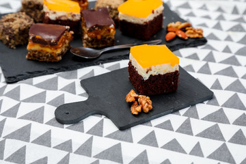 Homemade cake with caramel and oranges on a funcky background.