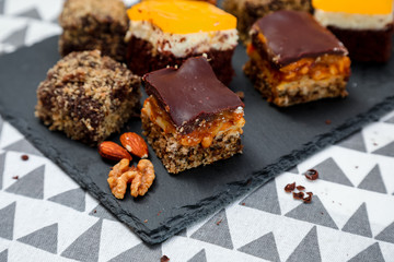 Homemade cake with caramel and oranges on a funcky background.