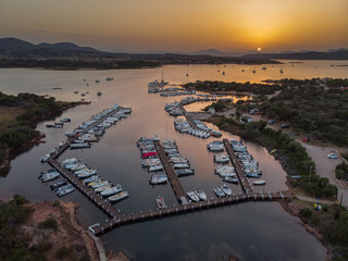 Aerial view on a sardinian harbor at the sunset