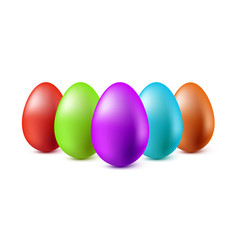 Color Easter eggs stand in a row on a white background.