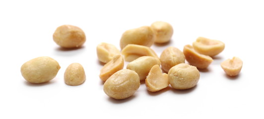 Salted and fried, roasted peanuts, pile isolated on white