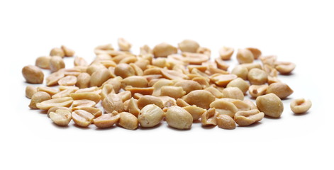 Salted and fried, roasted peanuts, pile isolated on white