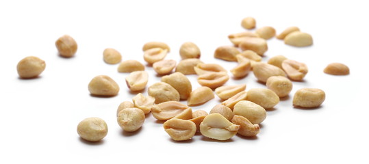 Salted and fried, roasted peanuts, pile isolated on white