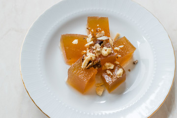 Turkish Crispy Pumpkin Dessert from Hatay / Kirecte Kabak Tatlisi with Walnut Powder.
