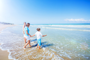 Happy family having fun in the summer leisure