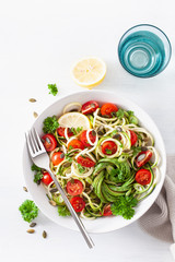 vegan ketogenic spiralized courgette salad with avocado tomato pumpkin seeds