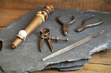  White pearl ring and jewelry tools