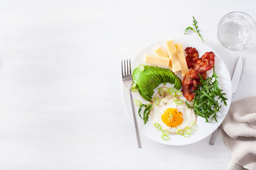 healthy keto breakfast: egg, avocado, cheese, bacon
