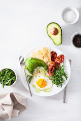 healthy keto breakfast: egg, avocado, cheese, bacon