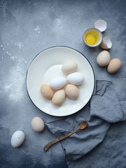 eggs in bowl with wooden spoon