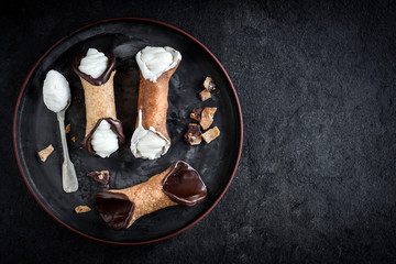 Traditional Sicilian dessert called cannoli with cream