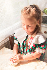  Little girl preparing the dough - 251556139