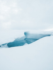 Fototapeta na wymiar Broken ice on a lake in Norway