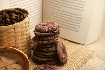 coffee beans and chocolate cookies and book on the table 