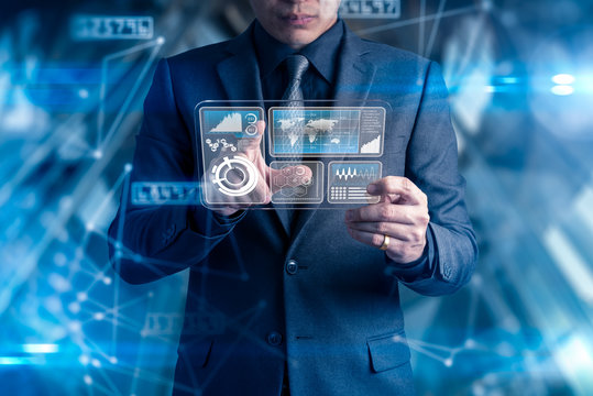 The double exposure image of the business man using a futuristic smartphone overlay with networking hologram image. The concept of modern life, business, city life and internet of things.