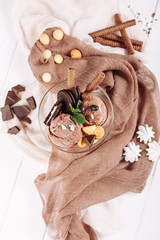 Chocolate Brown Icecream Sweet Dessert Flat Lay. Cold Delicious Ice Cream Ball with Mint Leaf and Cookie on Textile Background Top Down View. Gelato Flavor Serving Above Vertical Copy Space Banner