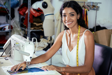 Dressmaker using sewing machine