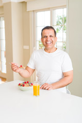 Senior man having cereals for breakfast in the morning