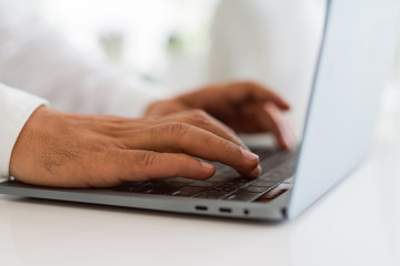 Close up of business man working using computer laptop