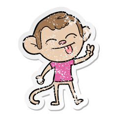 distressed sticker of a funny cartoon monkey making peace sign