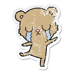 distressed sticker of a crying cartoon bear doing a sad dance