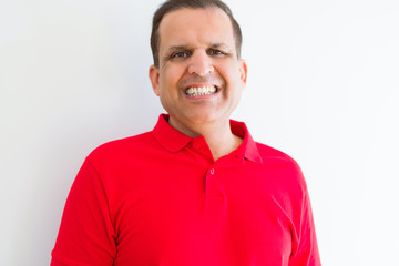 Middle age man smiling confident to the camera at home