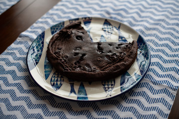 baked chocolate cake with cherries, made without flour