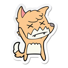 sticker of a cartoon cross eyed fox