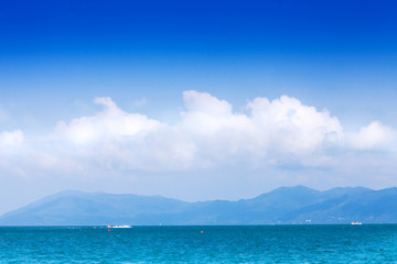 Wide seascape with clouds and mountains
