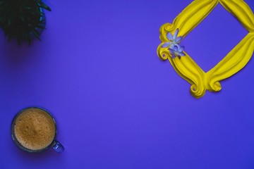 Purple background yellow frame notebook pen coffee mug globe flower flat lay instant photography camera keyboard computer 