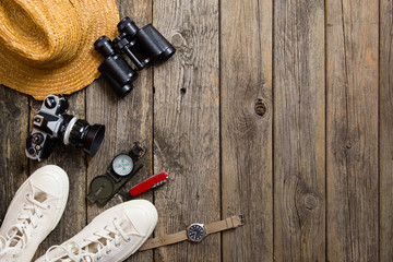 journey accessories on old wood background, top view