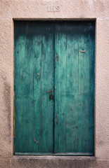 Teal wooden door in Dubrovnik, Croatia