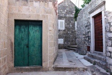 Fototapeta na wymiar Teal wooden door in Dubrovnik, Croatia