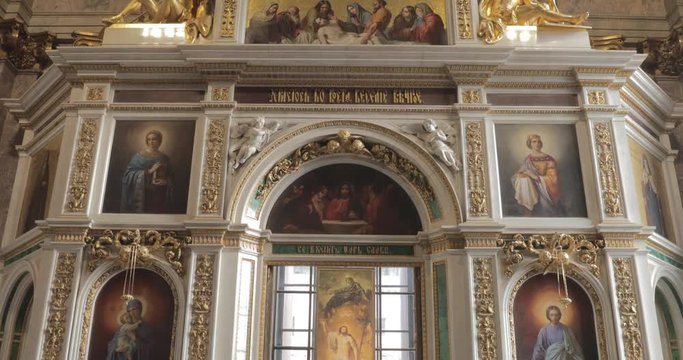 Interiors of Isaac cathedral, nobody, gold is everywhere, icons, sun, big window, museum, 4k video