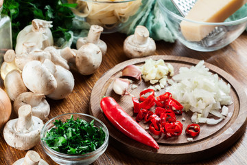 Ingredients ready for prepare tagliatelle pasta with champignon