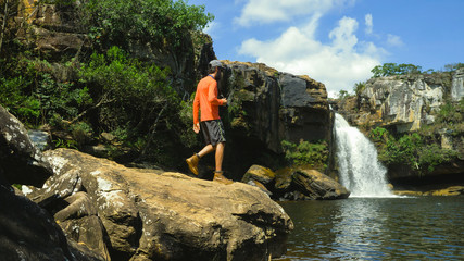 Man exploring nature with backpack and camera