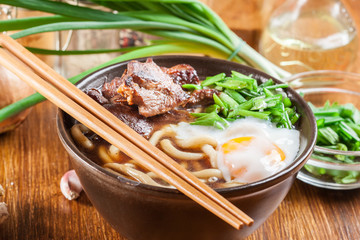 Japanese Udon noodles with beef, egg, green onion and soup