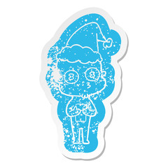 cartoon distressed sticker of a weird bald spaceman wearing santa hat