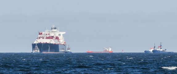 LNG TANKER - The big ship is sailing along waterway